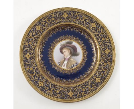 A late 19th/early 20th Viennese plate, decorated with a bust portrait of a young girl with a feathered hat and jewelled penda