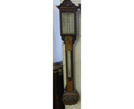 A J Gargory Birmingham oak cased stick barometer, with carved case and mercury filled thermometer, height 40.5ins 