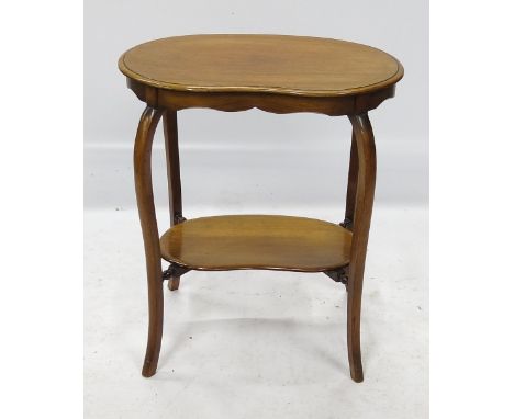 An Edwardian mahogany kidney shaped occasional table, raised on four cabriole legs, united by a shelf, width 24ins