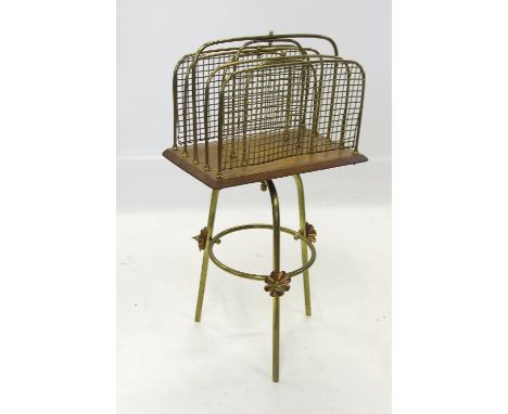 An early 20th century four division magazine rack, the revolving top raised on a brass tripod base, width 16ins