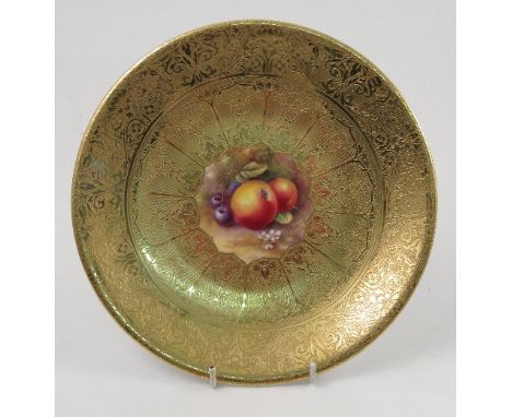 A Royal Worcester cabinet plate, decorated with a central panel of hand painted fruit by Price, to a deep acid gilt border, d