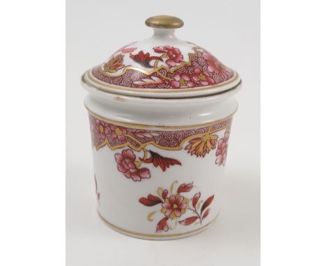 A 19th century Spode porcelain covered pot, of cylindrical form, decorated with flowers and scrolls in red, height 3ins Condi