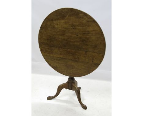 A 19th century oak occasional table, raised on a tripod base, width 30.5ins 