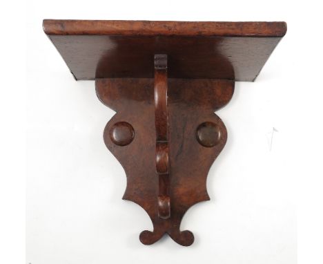 A 19th century Regency style pollard oak wall bracket, with scroll shelf support, height 14ins 