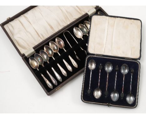 A set of six cased silver coffee bean spoons, Birmingham 1927, together with a hallmarked silver small ladle, a pair of hallm