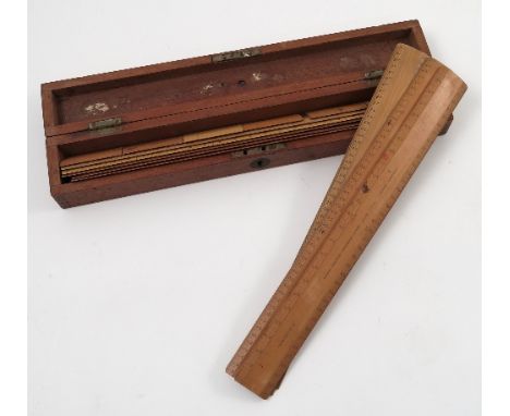 A cased set of Stanley wooden rulers, comprising eight wooden engine divided scale rulers, and six smaller rulers, missing ov