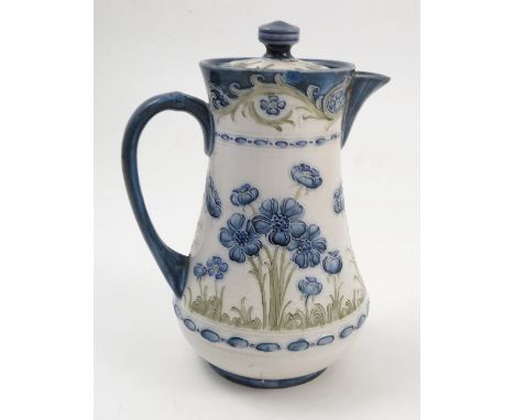 A Macintyre florian ware coffee pot, decorated with blue poppies to a green and blue ground, badly crazed, height 7ins, af Co
