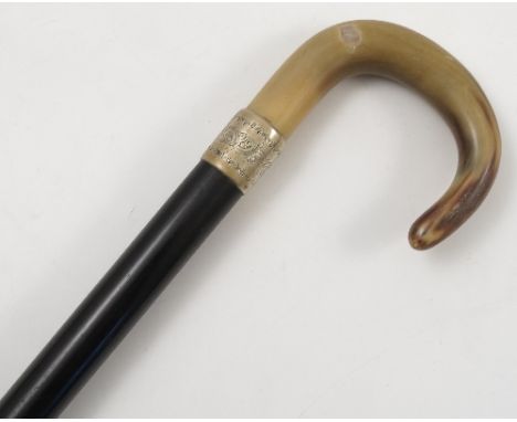 A horn and ebony walking stick, having horn handle, af, with white metal mount