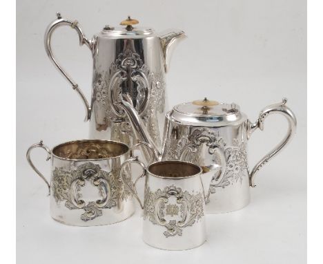 A group of silver plated items, to include a four piece tea set with embossed decoration, another tea set, a spirit kettle on