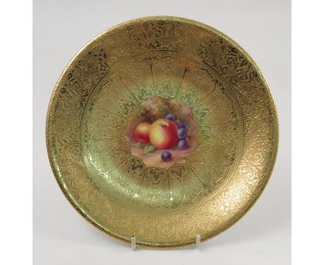 A Royal Worcester cabinet plate, decorated with a central panel of hand painted fruit by Price, to a deep acid gilt border, d