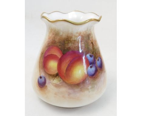 A Royal Worcester vase, hand painted to the front with fruit to a mossy background, by W Roberts, shape number G957, height 3