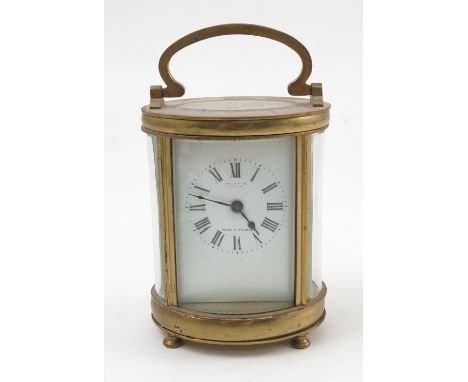 A French oval shaped carriage clock, retailed by Selfridges of London
