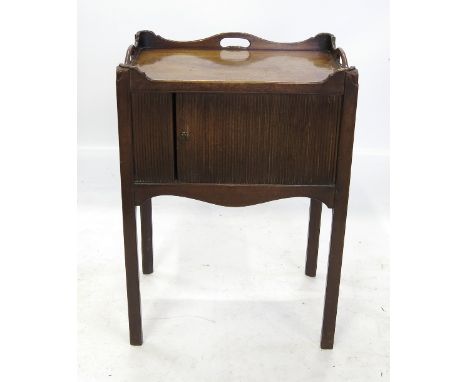 A Georgian mahogany tray top commode, with carrying handle apertures and tambour front, raised on square chamfered legs, widt