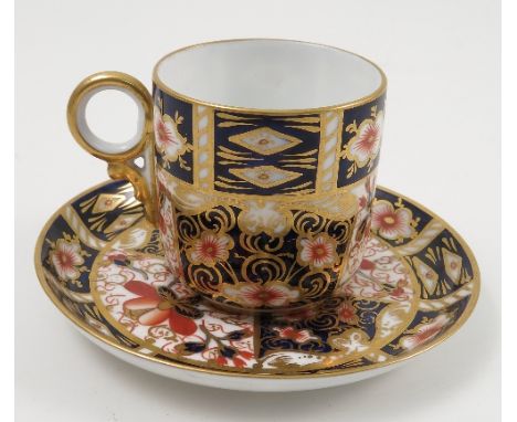 A Royal Crown Derby porcelain cabinet cup and saucer, decorated in the 2451 Imari pattern, dated 1903 Condition report: good 