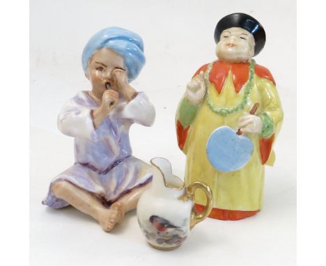 A Royal Worcester figure, India, modelled by F G Doughty, model number 3071, height 3.25ins, together with a Royal Worcester 