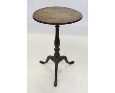 An Antique tripod table, the elm top raised on a turned column and three outswept supports, width 18ins 