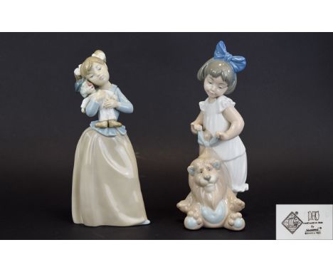 Nao by Lladro Figures ( 2 ) 1/ Girl with Large Toy Lion, Model No 1287. 10 Inches High, Mint Condition. 2/ Girl with Toy Clow