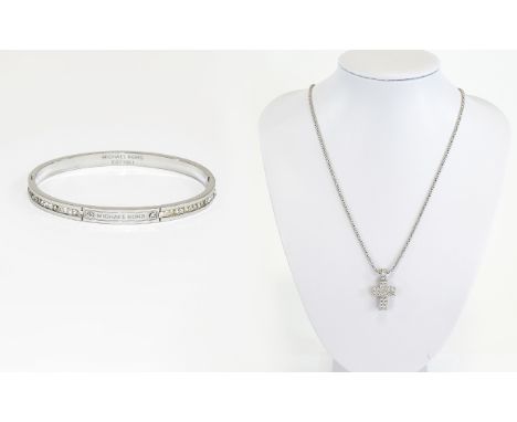 Crystal Set Cross Pendant And Bangle Long silver tone chain with cross pendant set with multiple Swarovski crystals. Also a s