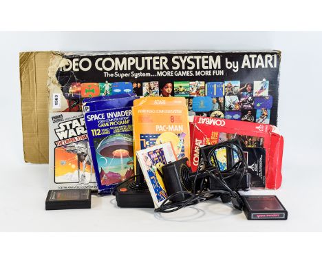 Atari 2600 Video Computer System, Model No CX-2600 + Star Wars, Space Invaders, Pac-Man, Combat & Air-Sea Battle Game Cartrid