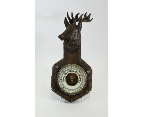 Small Carved Barometer surmounted with a head of a reindeer.