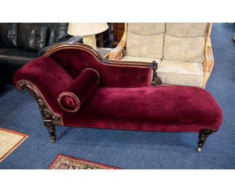 Antique Chaise Lounge Attractive day bed in dark wood with carved detail to back and leg tops. Castors to bottom, upholstered