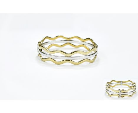 Ladies Two Tone White and Yellow Gold Hinged Bangle. c.1980's. Marked 375 - 9ct. Excellent Condition and Well Constructed. 17