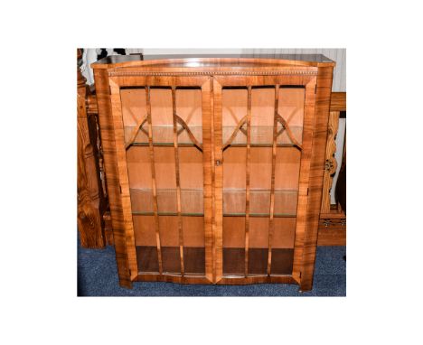 Display Cabinet Light wood glazed two door cabinet. Bow fronted with warm aged patina and locking front door with two interna