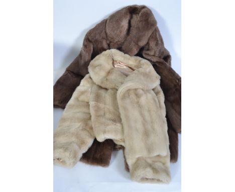 Two vintage fur coats, both lined to the interiors and dating to the mid 20th century