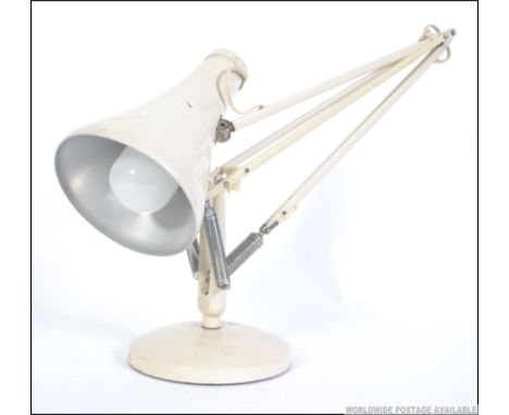 A vintage Herbert Terry anglepoise post war model Industrial desk lamp raised on round terraced base with pendant shade