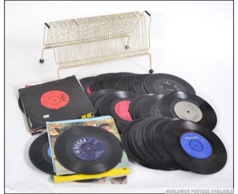 A quantity of vintage vinyl 45rpm 7" singles to include  various genres and artists dating from the 1960's onwards. Together 