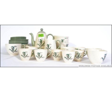 A 20th century part tea and coffee service by Copeland in the Olympus pattern consisting of pots, creamer, sugar bowls, trio'