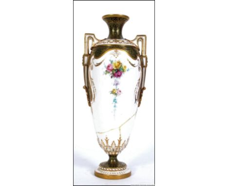 A 19th century Royal Worcester twin handled vase with scrolling gilt decoration having puce markings to the base with RD No 3