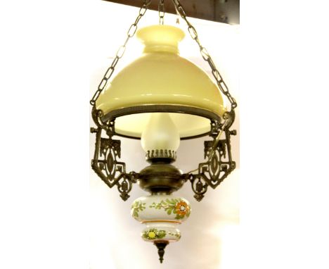 An oil lamp style ceramic and brass ceiling light.