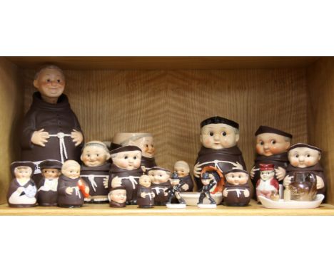 A collection of Goebel monk figures and other items.
