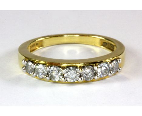 An 18ct yellow gold diamond set half eternity ring, approx. 0.5ct overall (K).