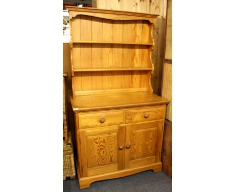 An Ercol pine dresser, W. 91cm, H. 168cm.