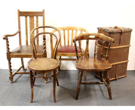 Three chairs and a vintage cabin trunk.