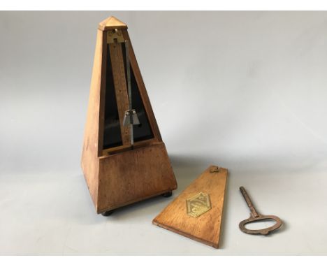 A mahogany cased metronome Maelzel with key, marked J.T.L. to front.