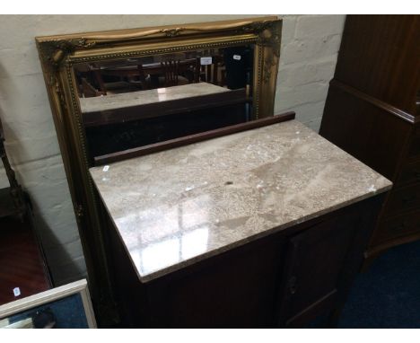 An oak two door, marble top cabinet with a gilt framed mirror.