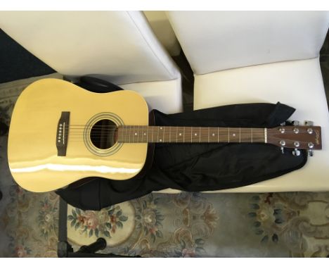 A Stagg acoustic guitar.