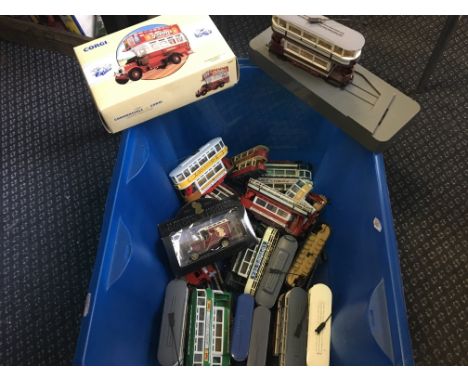 A box of Corgi buses and other vehicles.