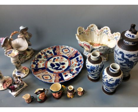 A floral painted vase, oriental plate, one large and two small oriental vases, a pair of Poole candlestick holders and five s