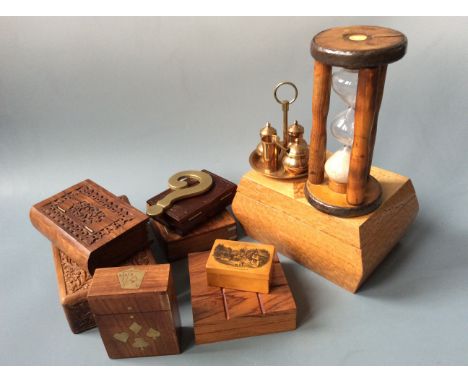 A sand timer, brass cruet set, boxes in form of books, boxes of cards, decorative box and wooden inlay box.