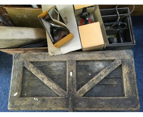 A wooden tool box with various tools.
