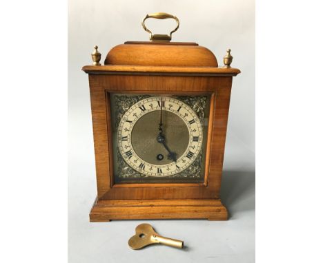 A Astral of Coventry mantel clock with brass detail to face. Height 27.5cm.
