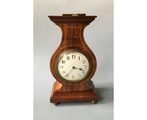 A lyre style cased French mantel clock. Height 24.5cm.