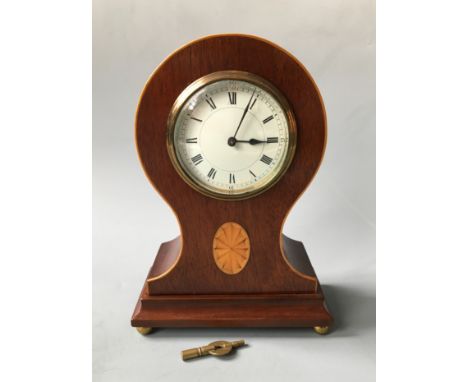 An Edward mahogany balloon shaped mantel clock with satinwood detail. Height 26cm.