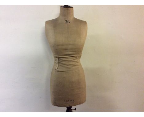 A Levine London-Paris early 20th century torso mannequin on tripod base.