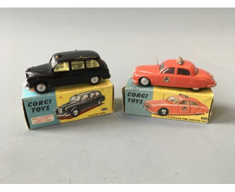 A Corgi 213 2.4 Jaguar fire service car and 418 Austin taxi, in boxes. (NO CONDITION REPORT, VIEWING OF LOT ADVISED.)