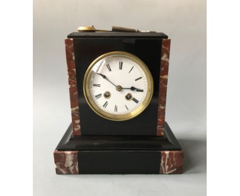A French 19th Century black and red marble mantel clock. Height 55cm.